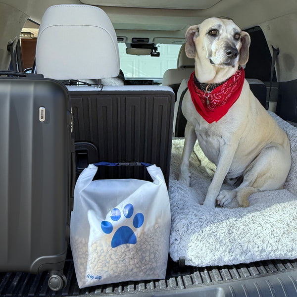 Durable roll-top reusable pet food bag with a secure closure for storing kibble or pet accessories during travel or on the go.