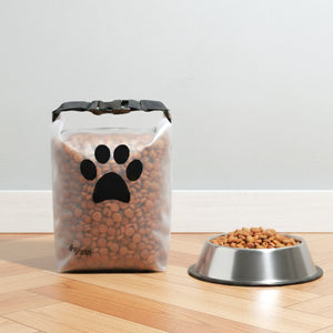 Reusable pet food storage bag with roll-top closure and built-in bowl, holds 14 cups of kibble—durable, food-grade PEVA travel container for dogs and cats.