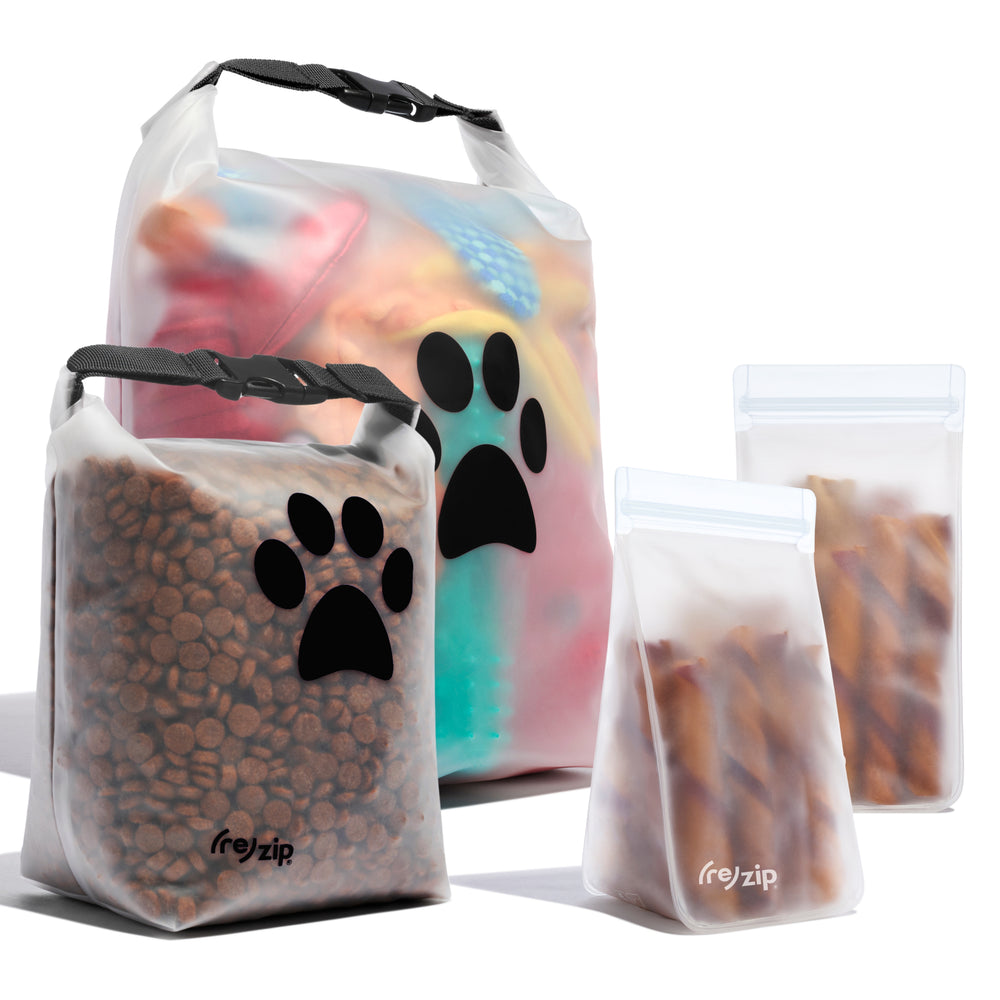 Reusable pet kit with 2 roll-top bags for dry food and toys, plus 2 tall bags for bully sticks and treats — perfect for organizing at home or taking on the go