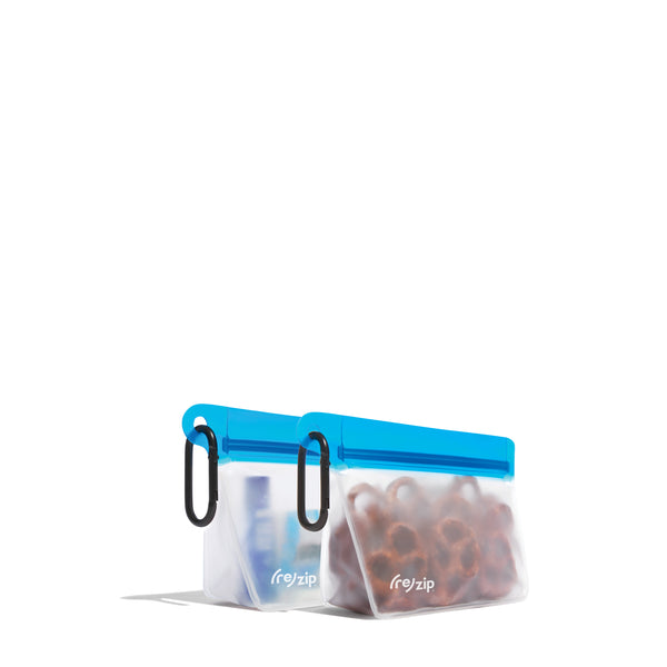 Cobalt reusable snack-sized bags with carabiner, filled with pretzels, lip balm, hand sanitizer – perfect for everyday essentials, on‑the‑go, hiking, and travel snack organization