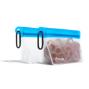 Cobalt (re)zip Take Me Too stand-up 1‑cup reusable snack bag with carabiner, filled with trail mix and fruit slices – perfect for on‑the‑go, hiking, and travel snack organization