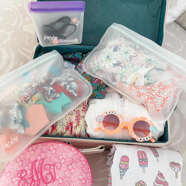 rezip reusable leak proof half gallon bags storing ribbons and clothing when travelling